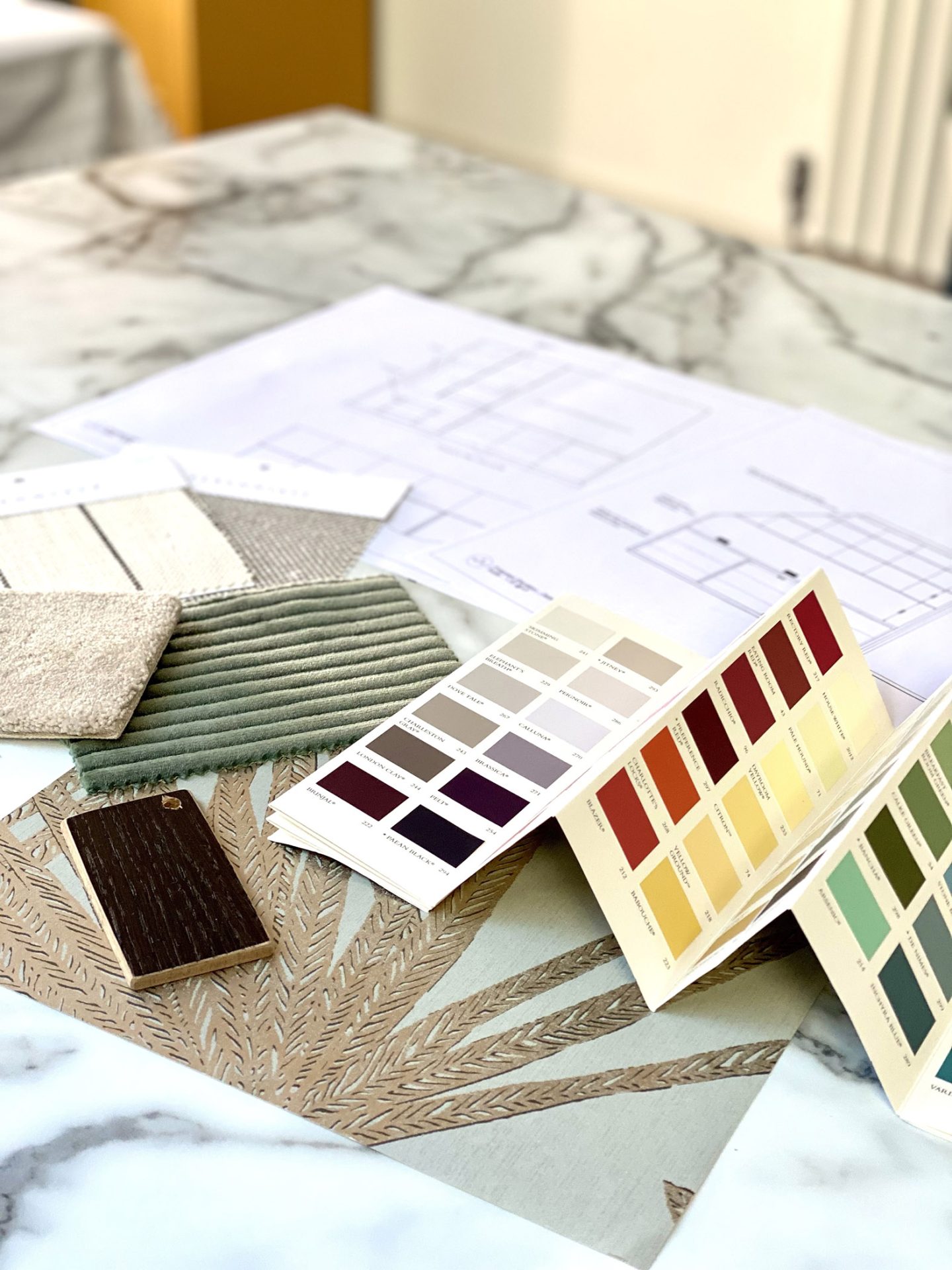 home interior designer with plans and colour charts