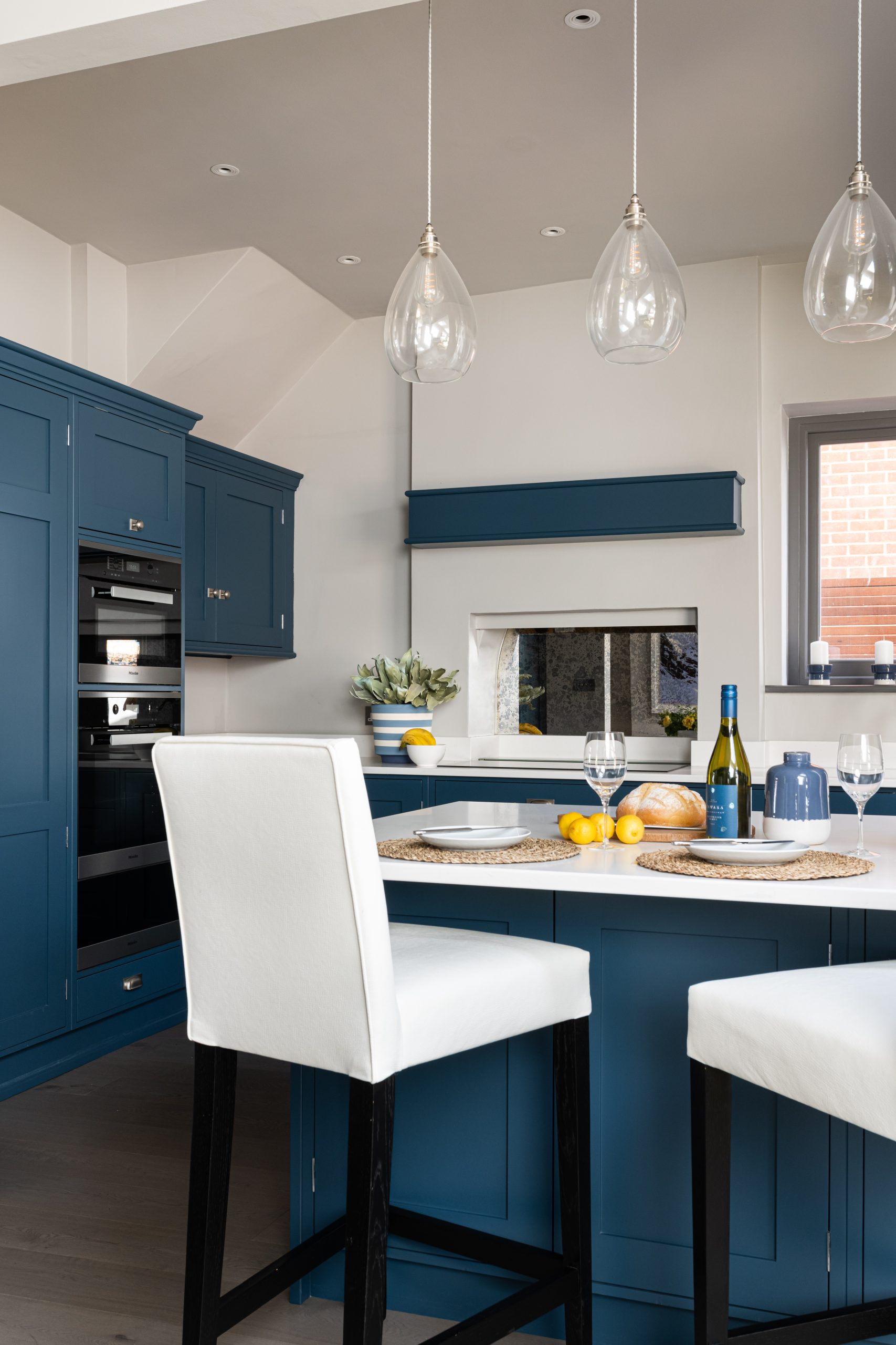 Breakfast bar area in bespoke kitchen home design by Emma Green