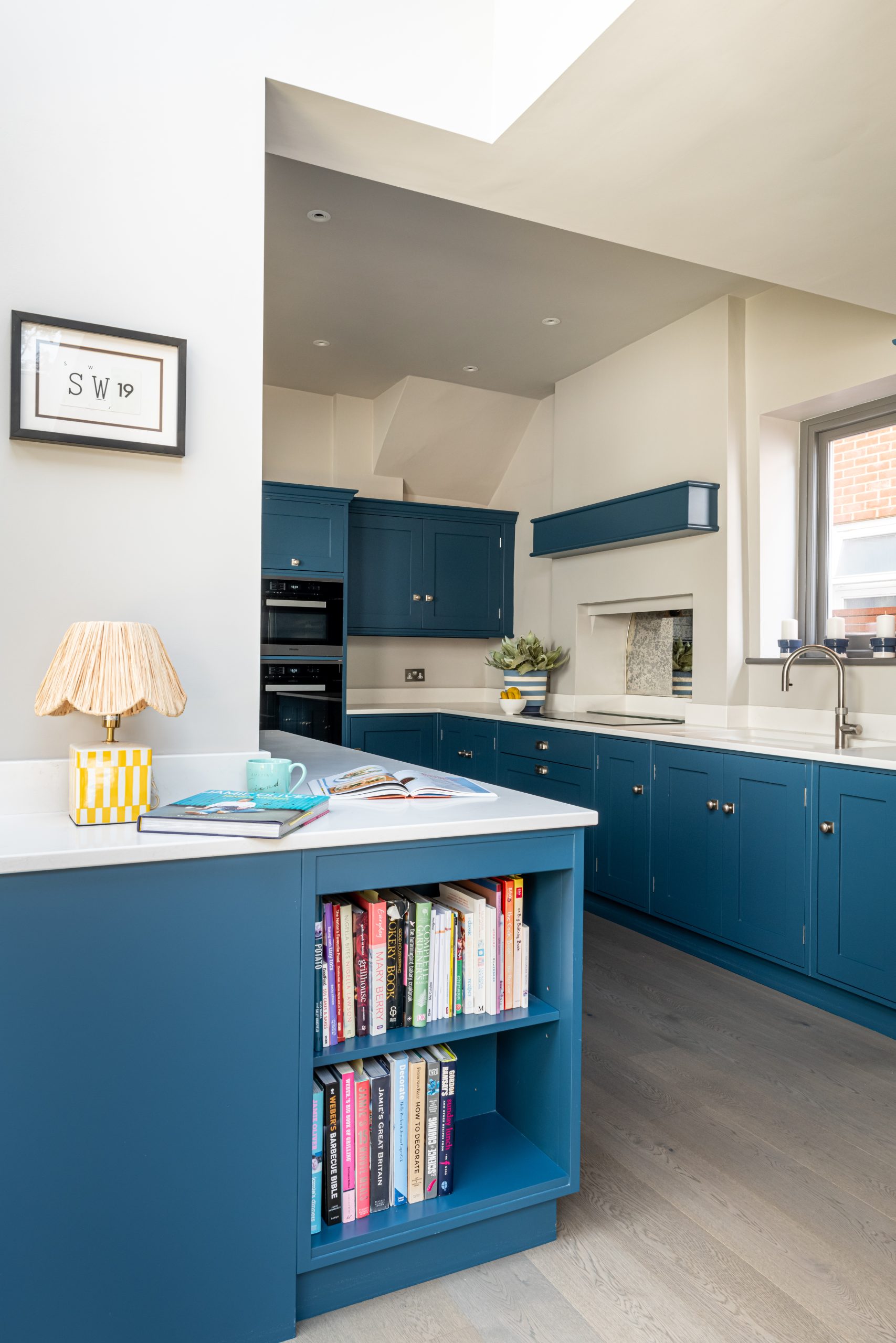 Bespoke cookery book shelving in luxury kitchen