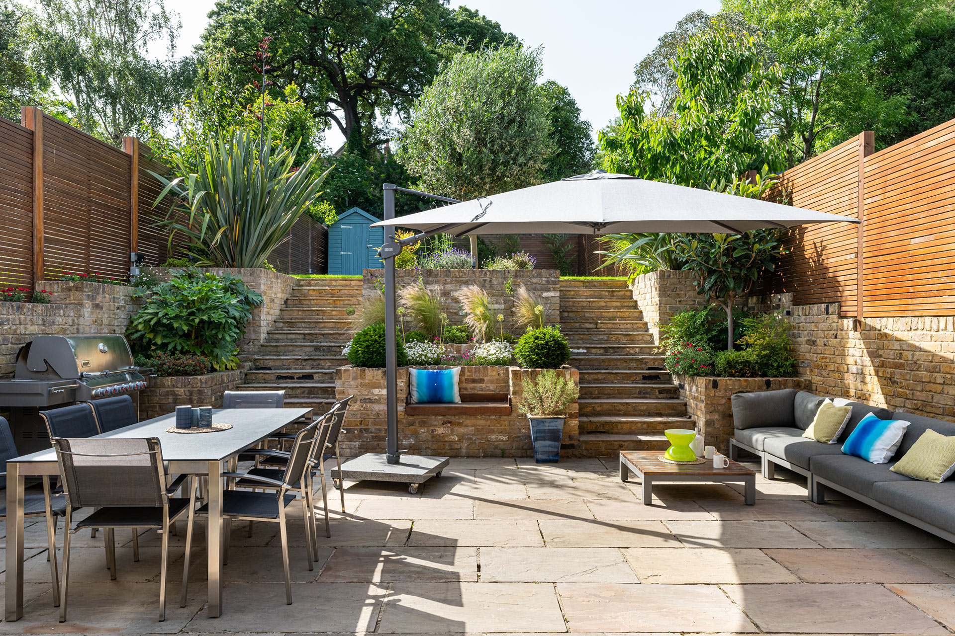 Views from the open-plan kitchen onto the garden in Wimbledon family home design by Emma Green