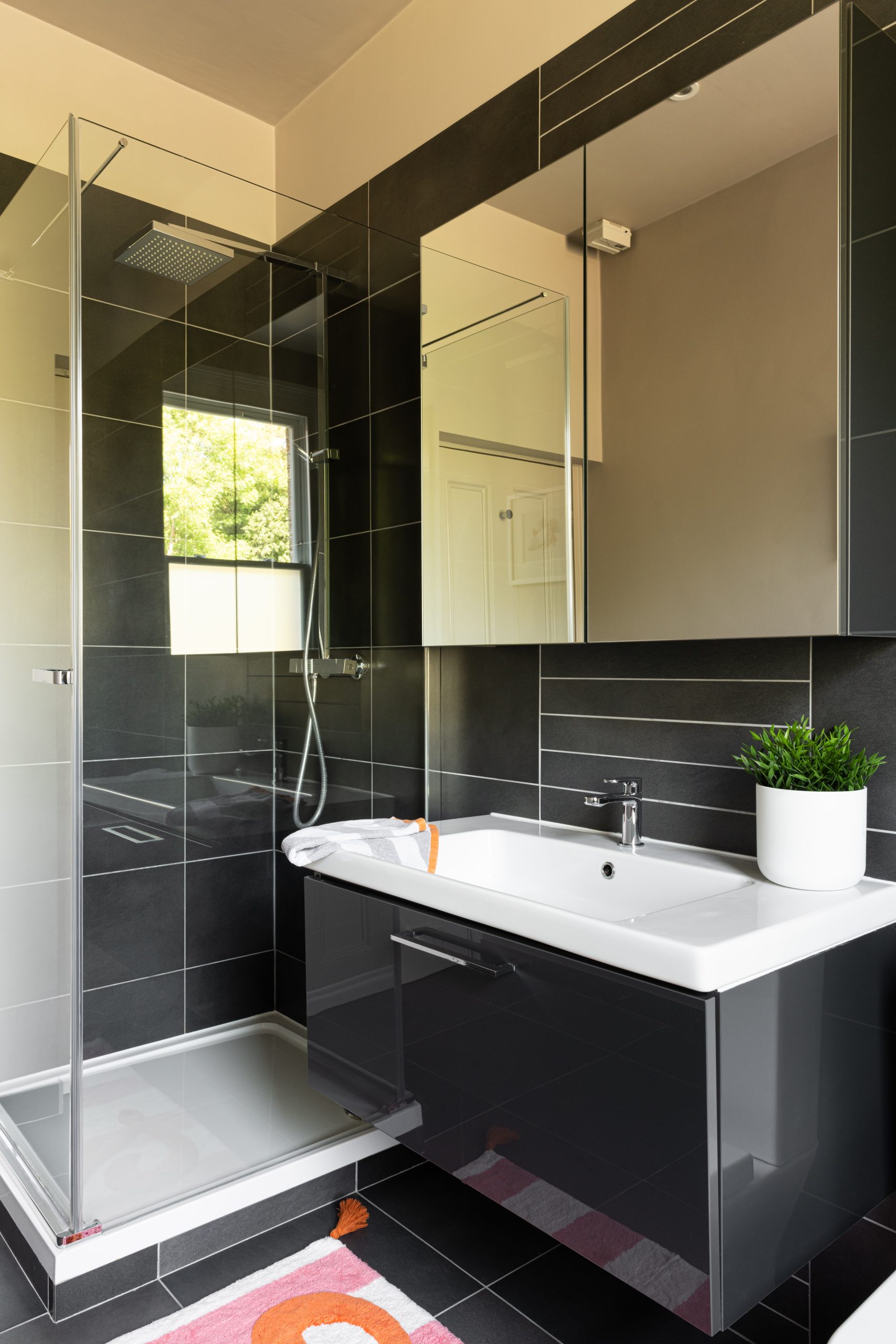 Modern lines create a smart, luxury bathroom in Wimbledon Village