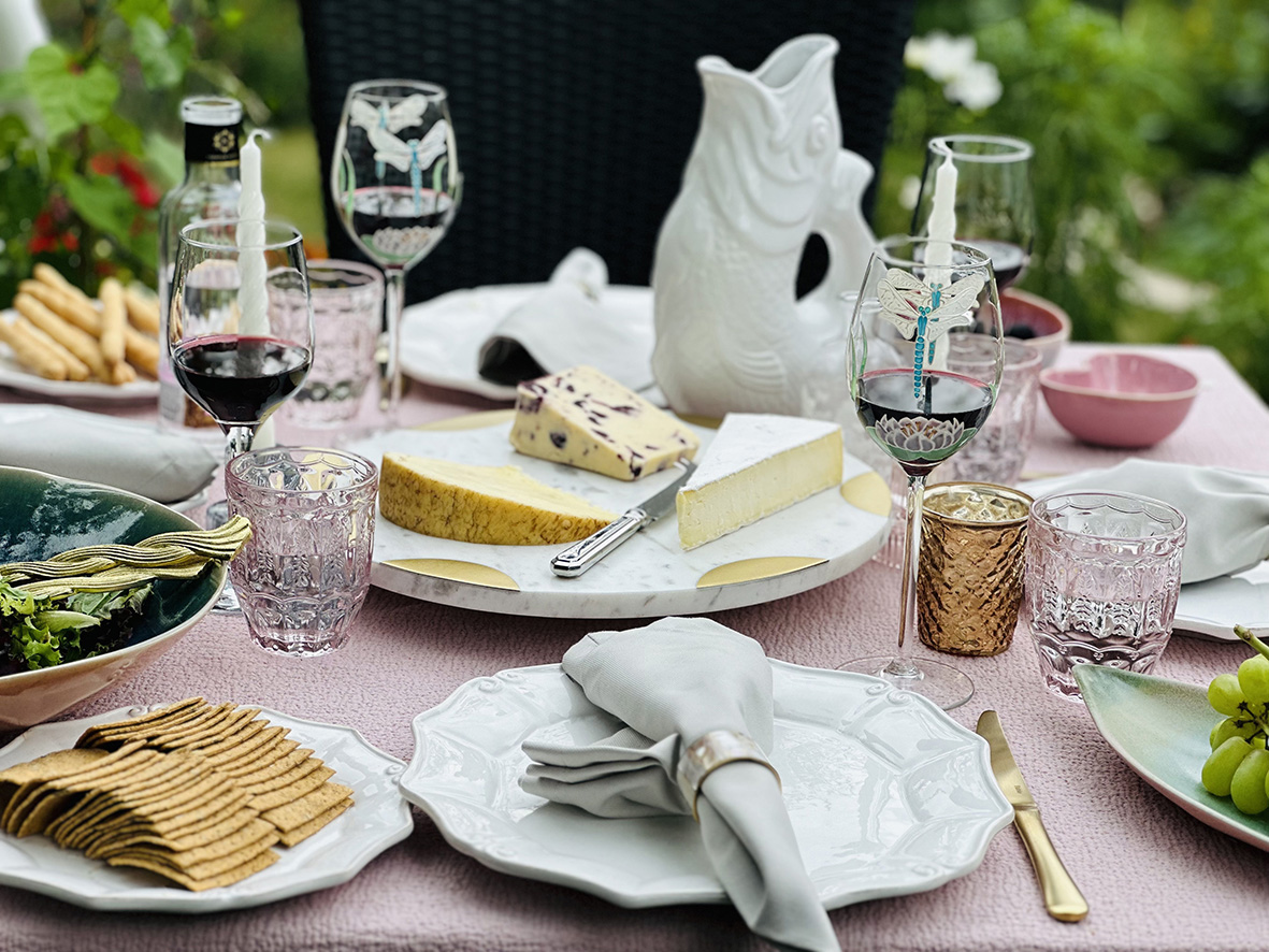 Cheese and wine table for outdoor dining in Style & decor blogger Sarah's garden