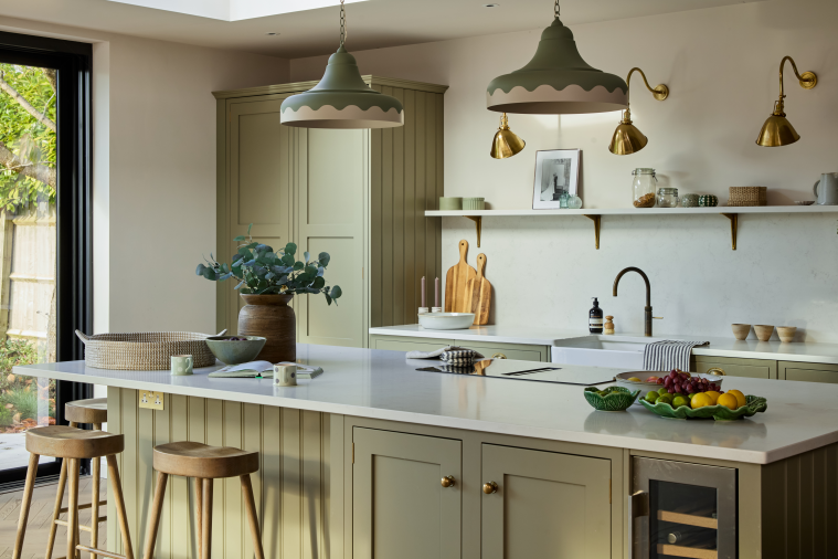 Sage green kitchen with brass lighting and island, Cotswolds interior design