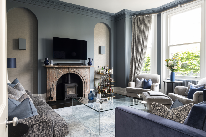 Luxury blue living room with fireplace and bespoke joinery, interior design by Emma Green Design London